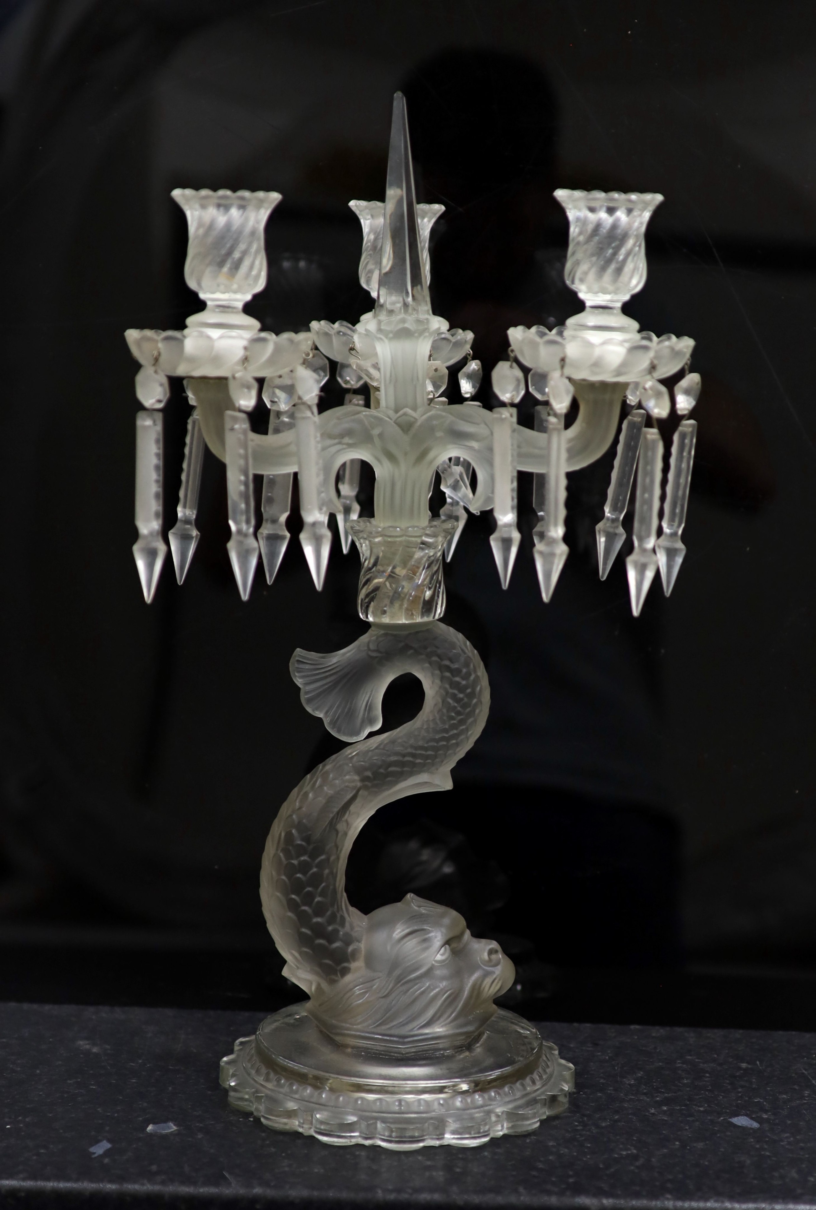 A pair of Baccarat moulded and frosted glass candelabra and another similar, late 19th century, 47 and 48.5cm high (3)